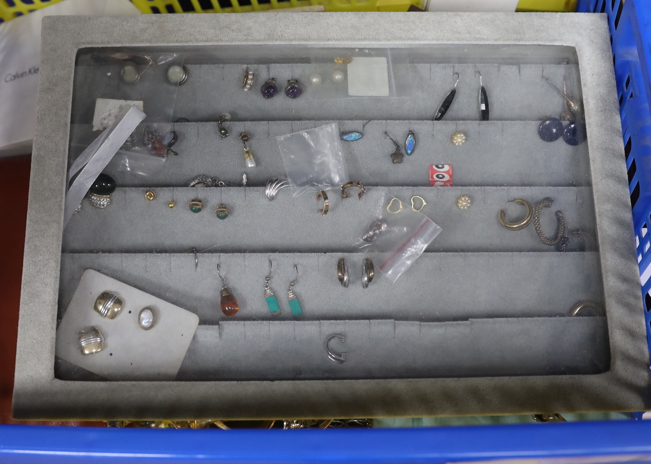 Costume jewellery including a case of earrings.